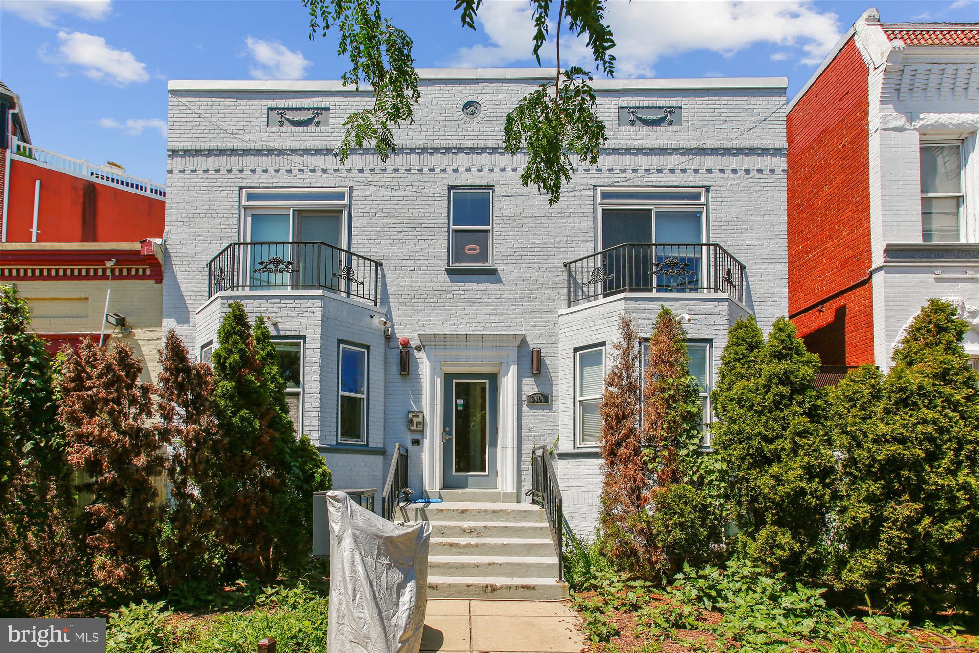 3404 13th Street Northwest, Unit 102 Washington, DC 20010 - Photo 1 of 29 a front view of a house with a garden