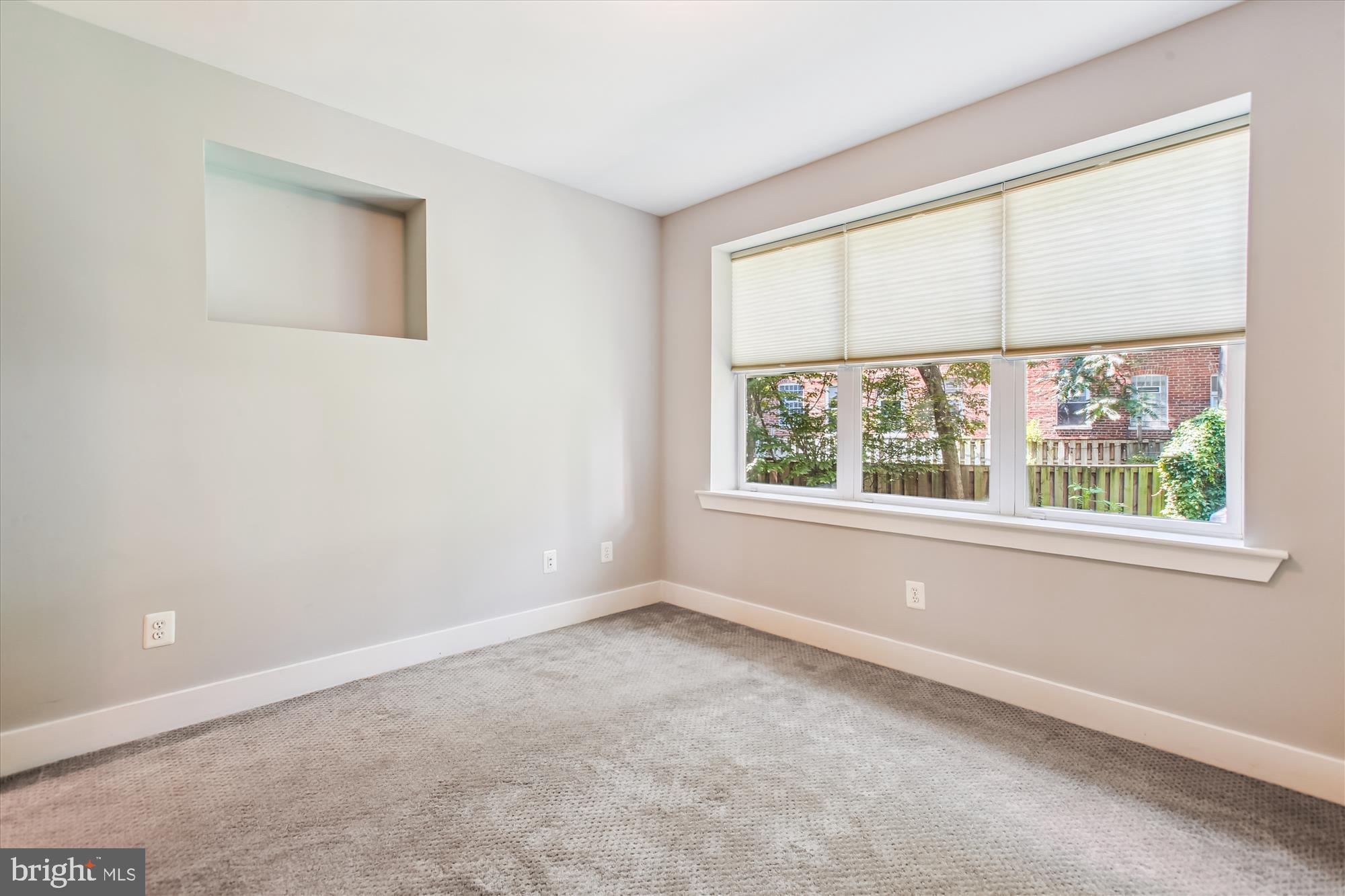 3404 13th Street Northwest, Unit 102 Washington, DC 20010 - Photo 11 of 29 an empty room with a window