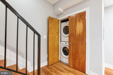 a view of a hallway with washer and dryer