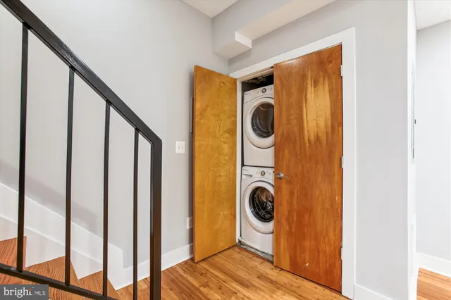 a view of a hallway with washer and dryer