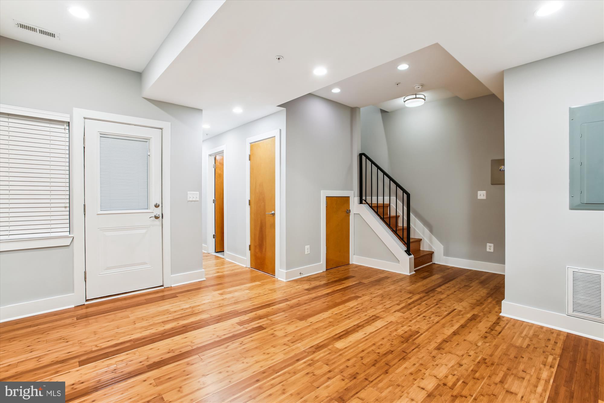 3404 13th Street Northwest, Unit 102 Washington, DC 20010 - Photo 15 of 29 a view of an empty room with wooden floor and stairs