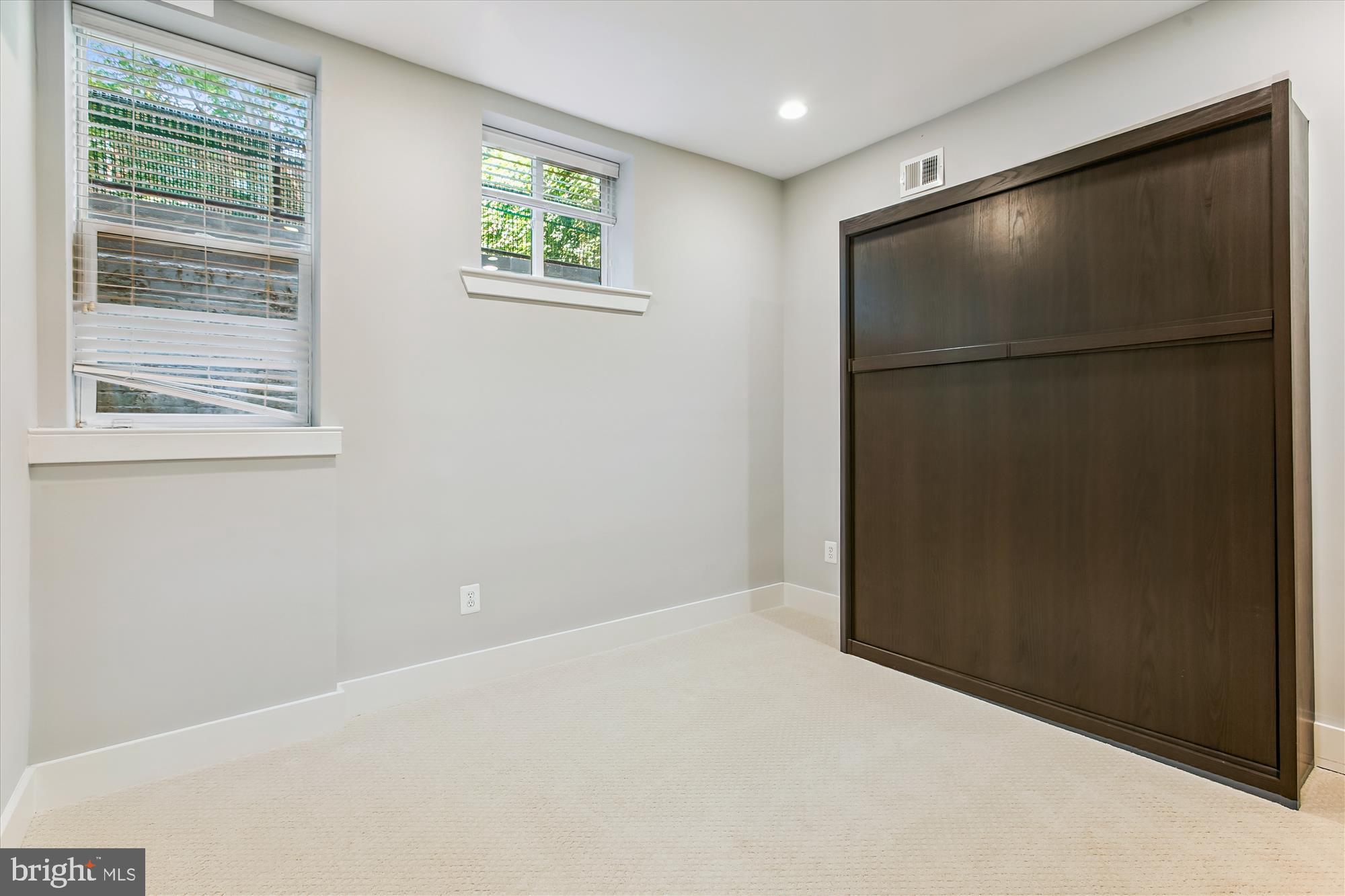 3404 13th Street Northwest, Unit 102 Washington, DC 20010 - Photo 18 of 29 a view of an empty room with a window