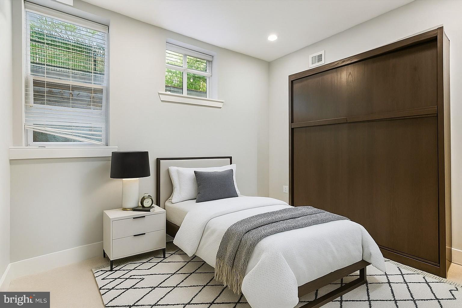 3404 13th Street Northwest, Unit 102 Washington, DC 20010 - Photo 19 of 29 a bedroom with a bed and a window