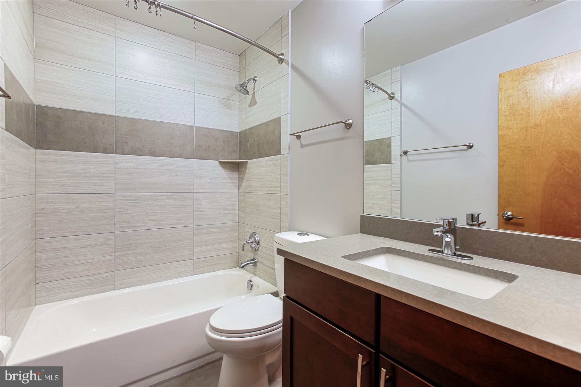 3404 13th Street Northwest, Unit 102 Washington, DC 20010 - Photo 20 of 29 a bathroom with a sink a toilet and shower