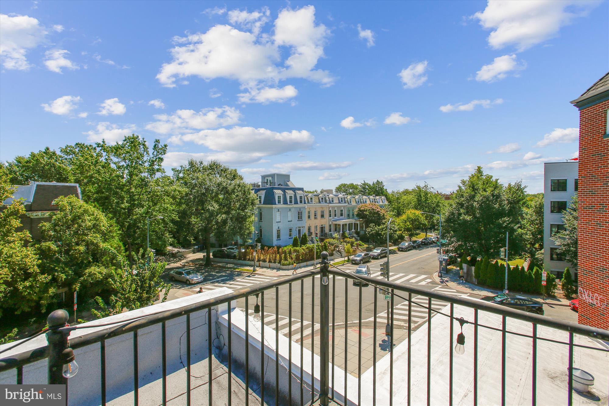 3404 13th Street Northwest, Unit 102 Washington, DC 20010 - Photo 24 of 29 a view of a city from a balcony