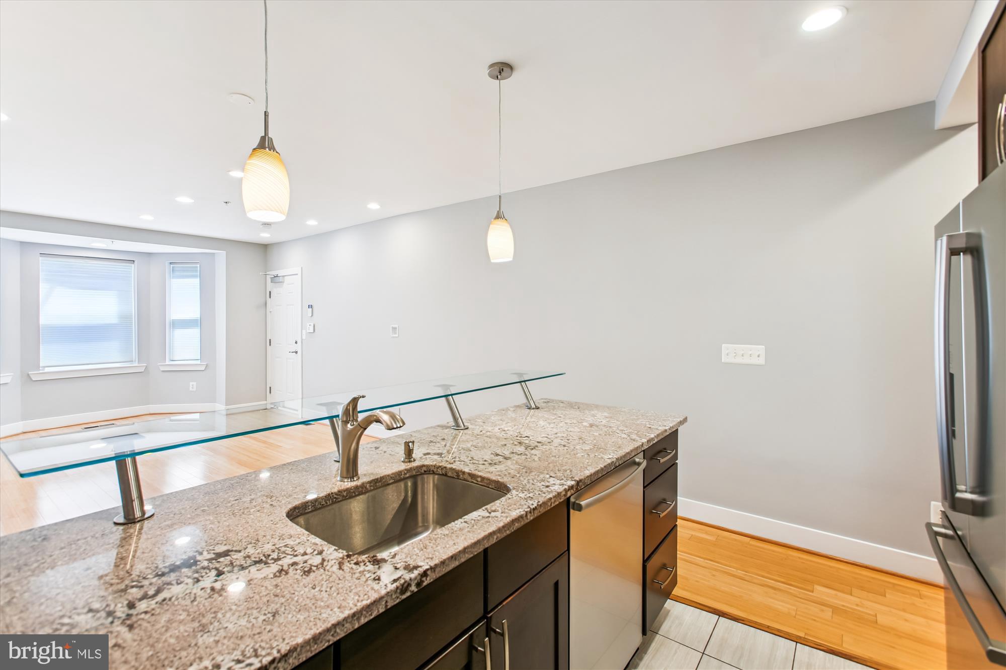 3404 13th Street Northwest, Unit 102 Washington, DC 20010 - Photo 8 of 29 a kitchen with a sink and a window