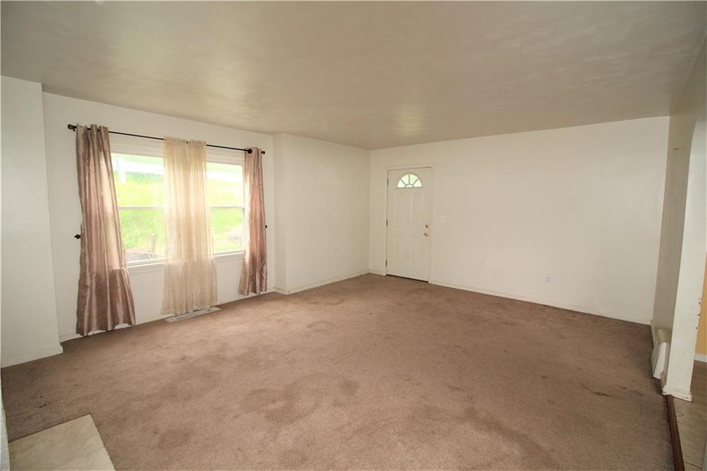 1456 Rte 481 Charleroi, PA 15022 - Photo 3 of 25 The 18x14 Living Room has Two Large Windows and Access to the Exterior Covered Side Porch.