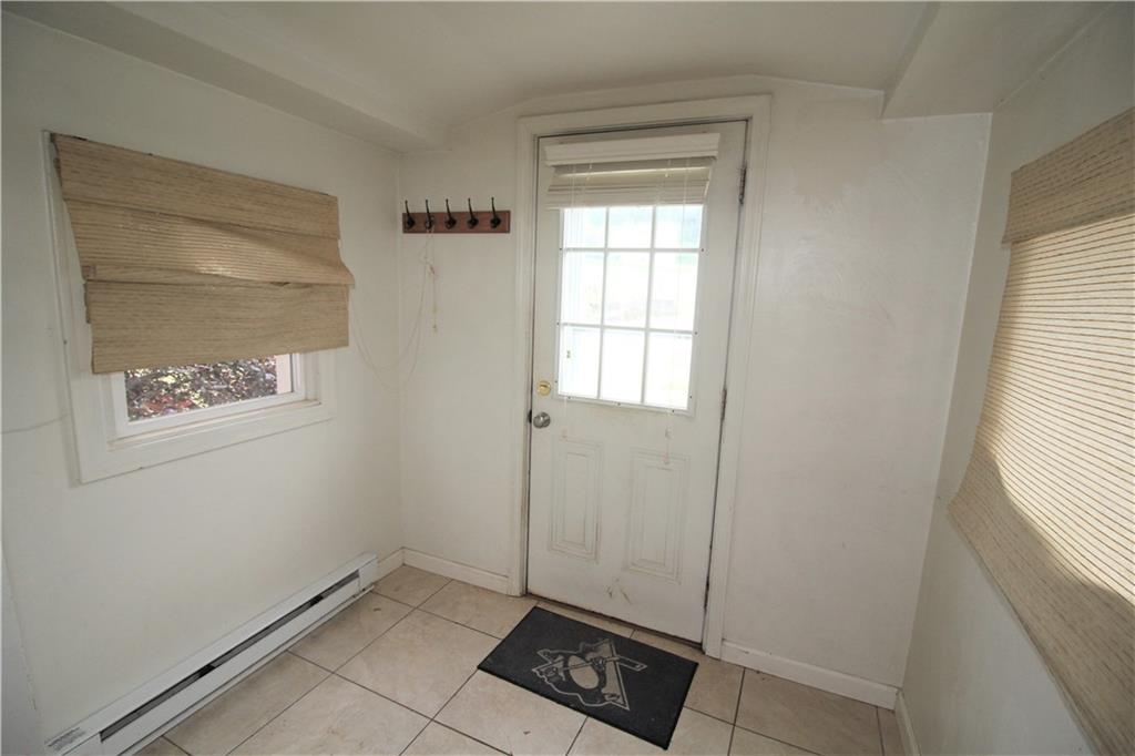 1456 Rte 481 Charleroi, PA 15022 - Photo 8 of 25 7x5 Entryway off of Wooden Deck is a Great spot for Coats and Shoes and Cleaning Supply Storage!