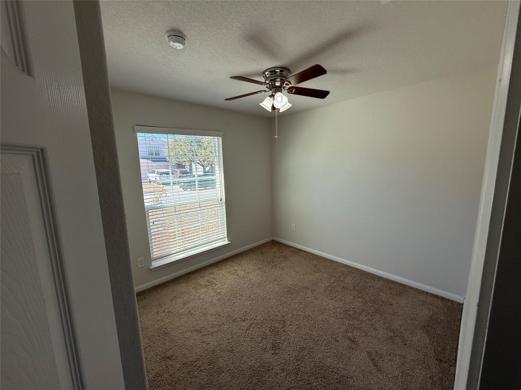 206 Windridge Drive North Lockhart, TX 78644 - Photo 17 of 20 a view of empty room with window