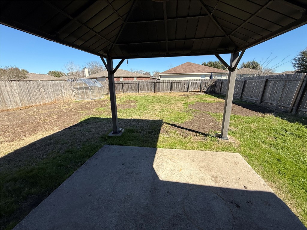 206 Windridge Drive North Lockhart, TX 78644 - Photo 19 of 20 a view of a swimming pool with a patio