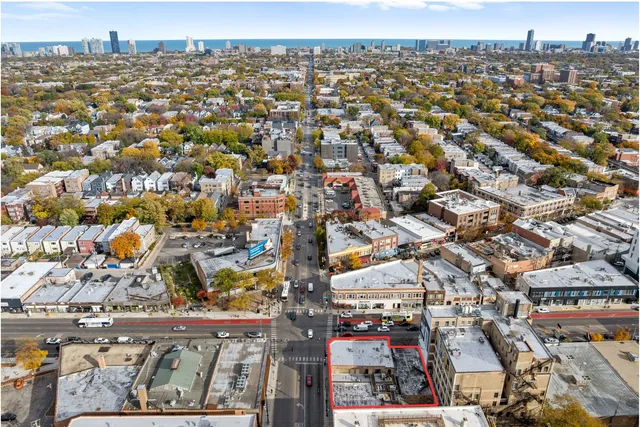 a view of cars parked in front of a house