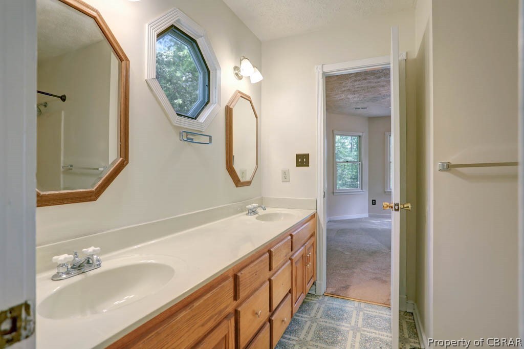 7025 Mumford Cove Road Hayes, VA 23072 - Photo 25 of 43 Jack and Jill bath between bedroom 1 & 2.
