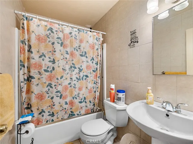 a room with gym equipment and a flat screen tv