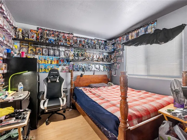 a bed room with a bed and a lamp