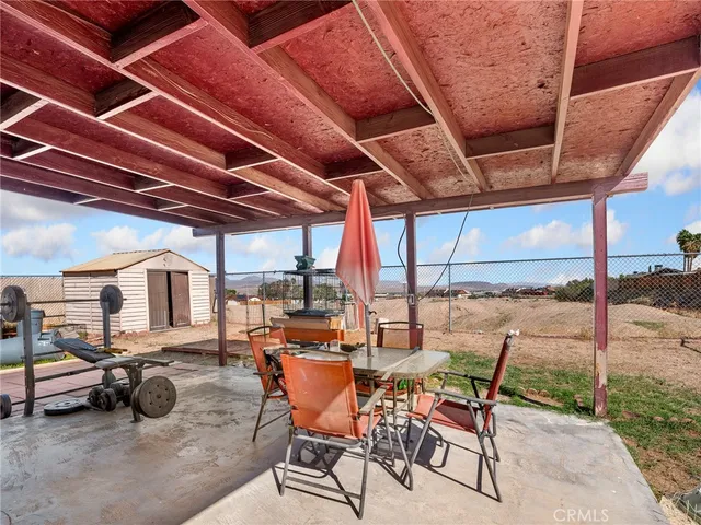 a view of a house with backyard and porch