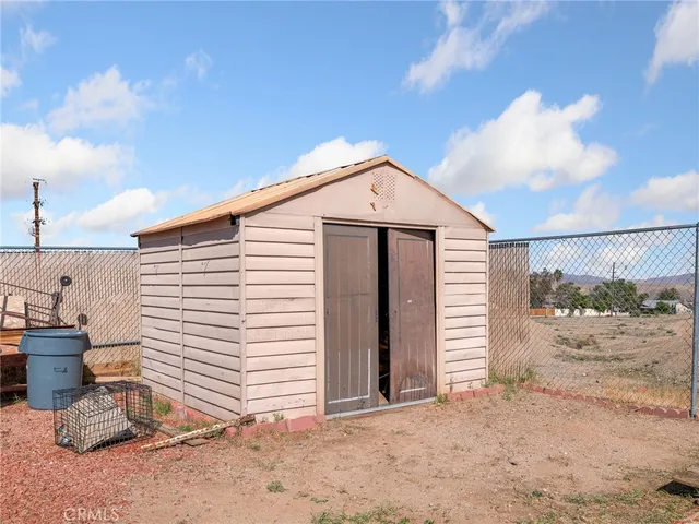 a view of a house with sitting area and garden
