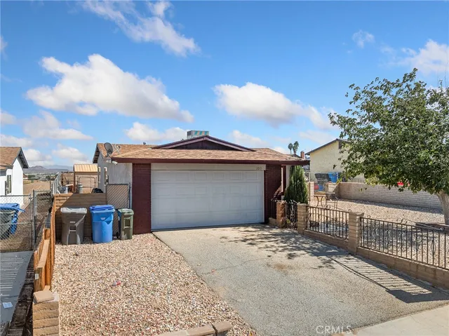 a front view of a house with a backyard