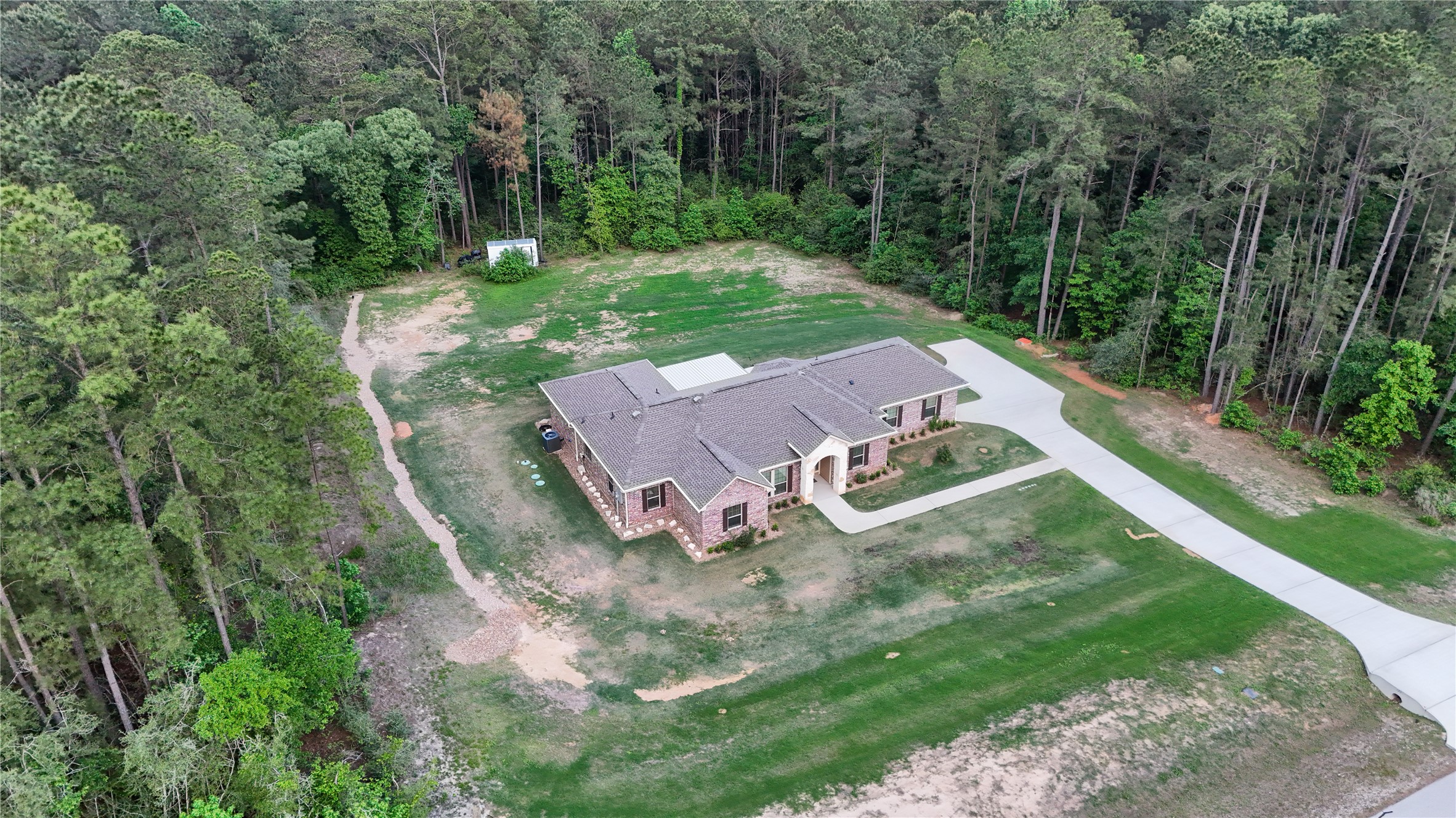 120 Sanctuary Road Huntsville, TX 77340 - Photo 37 of 38 an aerial view of a house with a yard