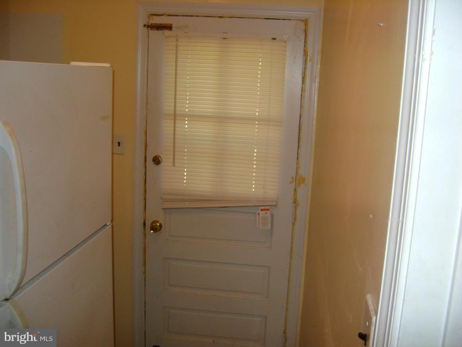 11906 Fort Washington Road Fort Washington, MD 20744 - Photo 11 of 30 Utility area with refrigerator next to kitchen