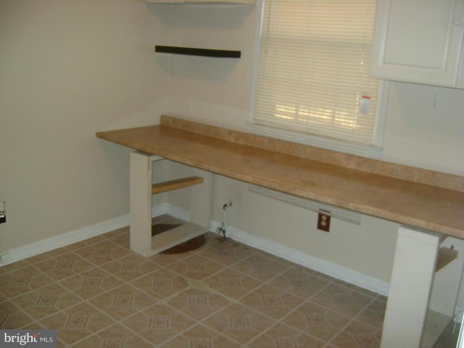 11906 Fort Washington Road Fort Washington, MD 20744 - Photo 10 of 30 Laundry room storage with Sump Pump