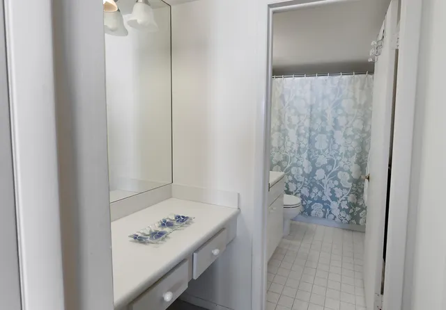 a bathroom with a bathtub and shower