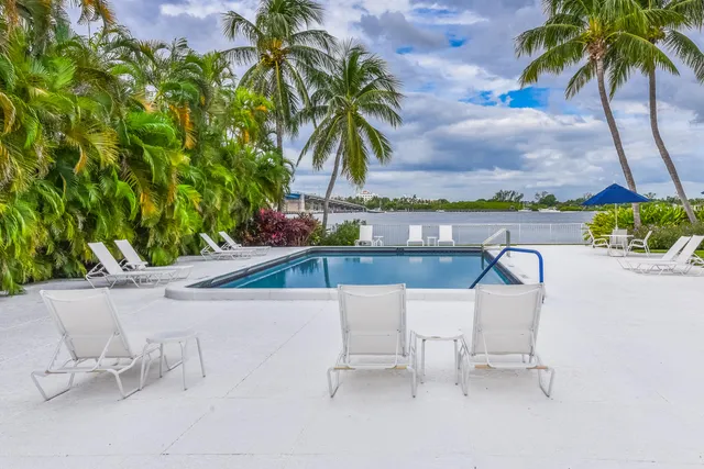 a view of swimming pool with a table and chairs