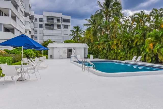 a view of a chairs and table in the patio