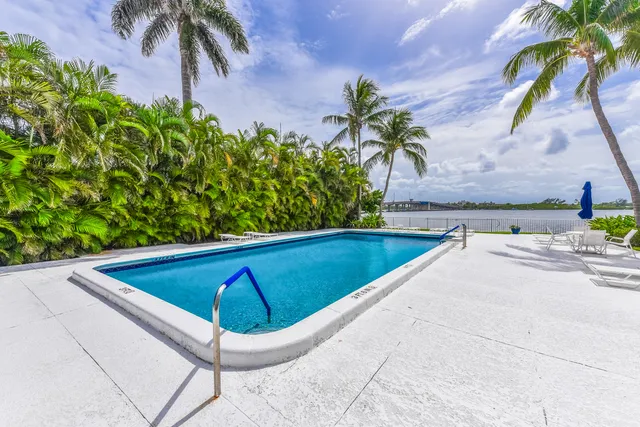 a view of swimming pool with chairs