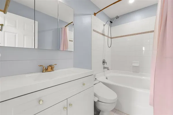 a bathroom with a sink a toilet and a bathtub