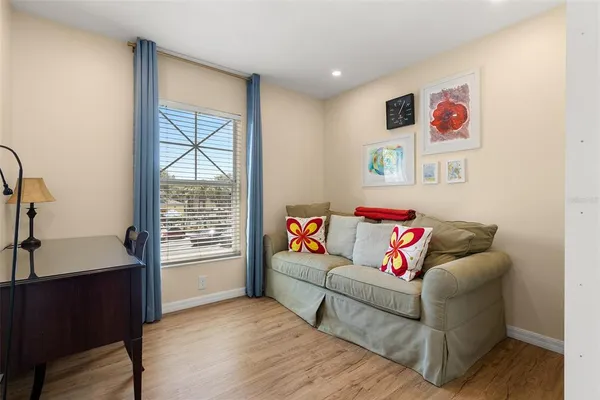 a living room with furniture and a window