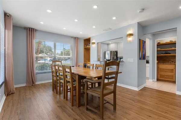 a view of a dining area with furniture window and wooden floor
