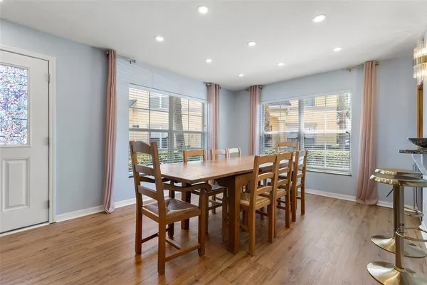 a view of a dining room with furniture window and wooden floor