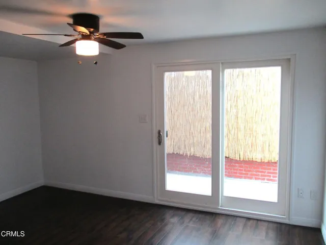 a picture of a ceiling fan and window
