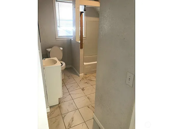 a bathroom with a sink and a toilet
