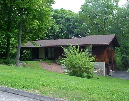 35 Sturbridge Road Easton, CT 06612 - Photo 1 of 1 a view of a house with a yard plants and large tree