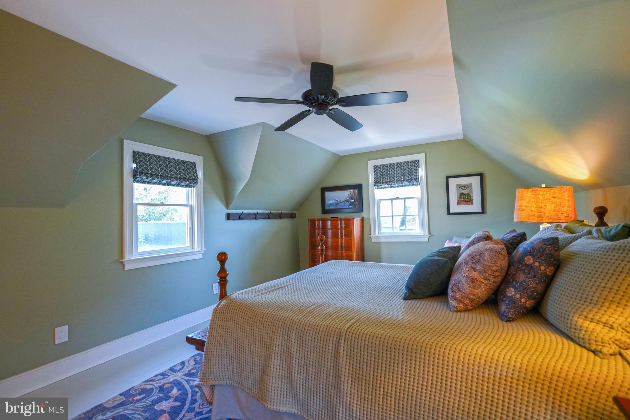 410 Pilottown Road Lewes, DE 19958 - Photo 77 of 114 a bedroom with a bed and a chandelier