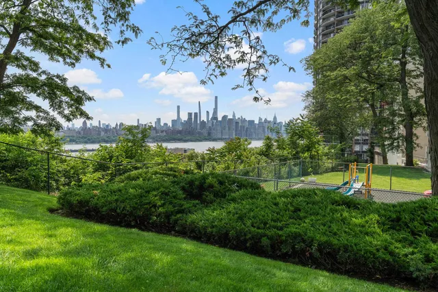 a view of a swimming pool with a yard
