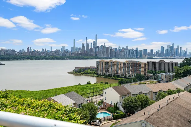 a view of a city with a lake