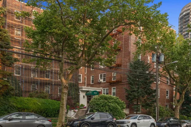 a city street lined with buildings and trees