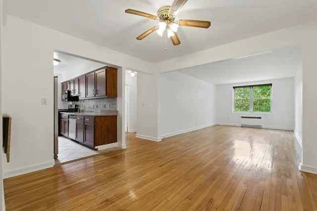 a view of kitchen with sink and wooden floor