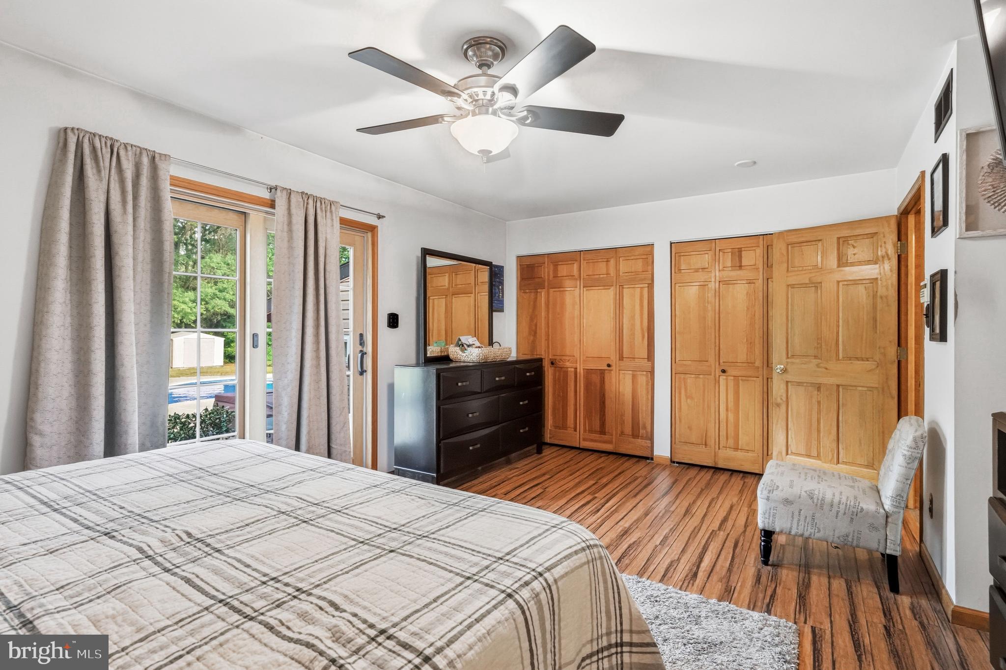 705 Garden Road Pittsgrove, NJ 08318 - Photo 36 of 72 a bedroom with a bed and wooden floor