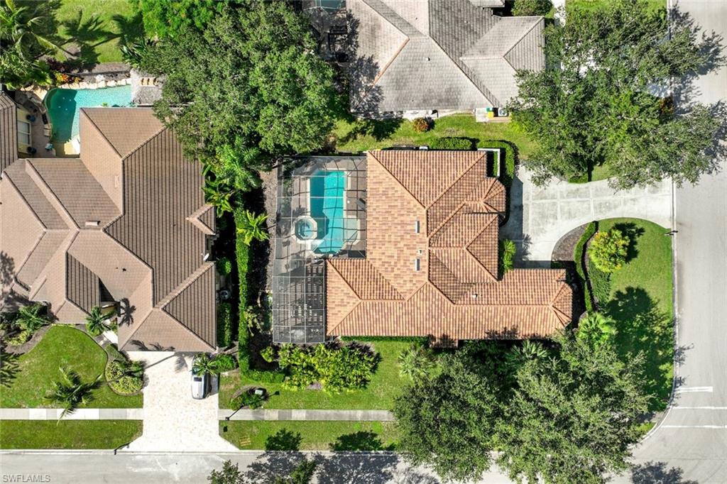 3960 Deep Passage Way Naples, FL 34109 - Photo 30 of 34 Comprehensive aerial view, showcasing the property's layout, surrounding landscape, and architectural details from a bird's-eye perspective.
