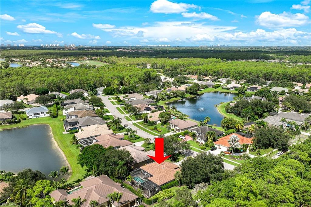 3960 Deep Passage Way Naples, FL 34109 - Photo 31 of 34 Aerial view of residential area.