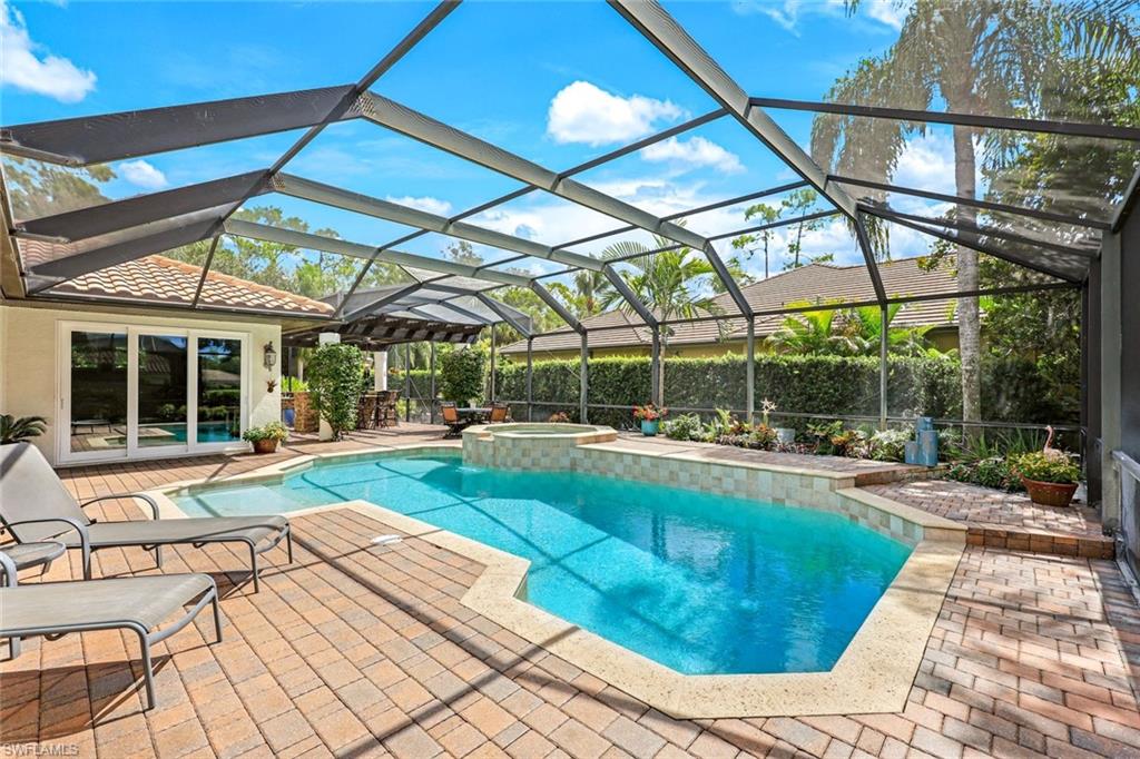 3960 Deep Passage Way Naples, FL 34109 - Photo 7 of 34 Heated saltwater pool and spa, perfect for relaxation year-round.