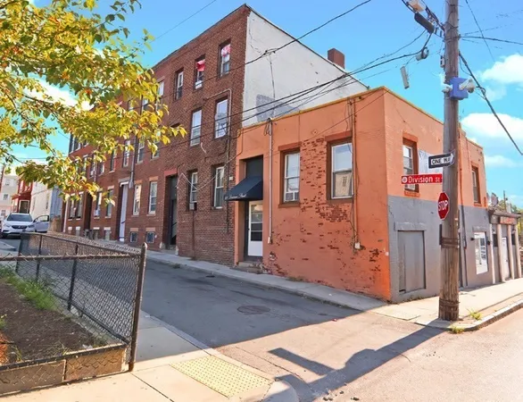 a front view of a building with street view