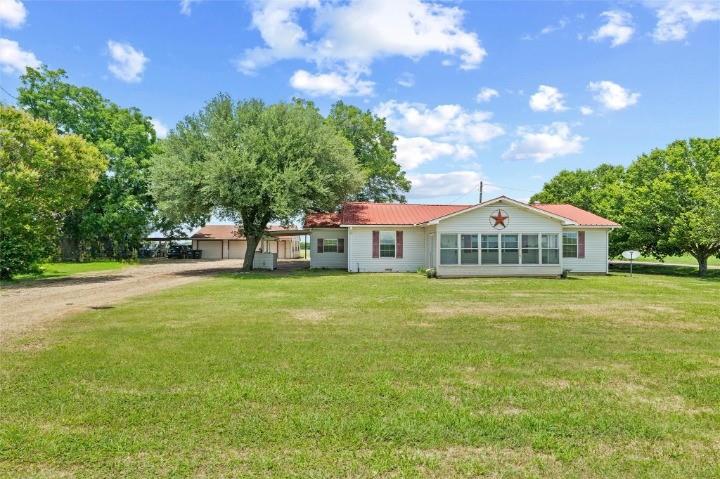 358 Wright Road Waxahachie, TX 75167 - Photo 1 of 38 a front view of a house with garden