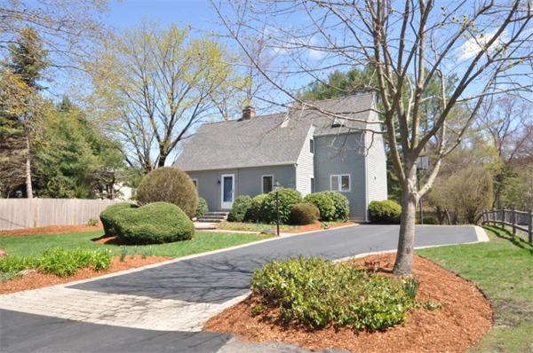 34 Valleyfield Street Lexington, MA 02421 - Photo 1 of 13 a front view of a house with a yard and a garden