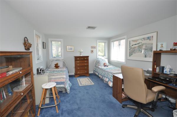 34 Valleyfield Street Lexington, MA 02421 - Photo 11 of 13 a living room with furniture a window and a flat screen tv