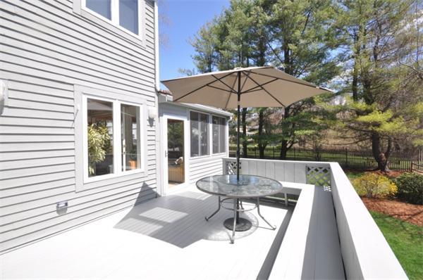 34 Valleyfield Street Lexington, MA 02421 - Photo 12 of 13 a view of a patio with a table and chairs under an umbrella