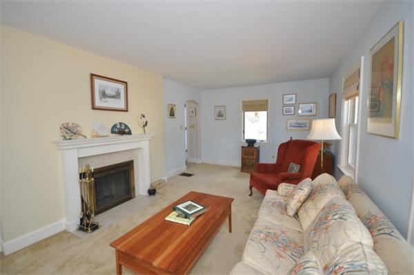 34 Valleyfield Street Lexington, MA 02421 - Photo 2 of 13 a living room with furniture and a fireplace